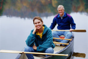 Man & Woman canoeing on Lake Winnipeg